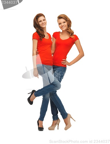 Image of two beautiful teenage girls in red t-shirts