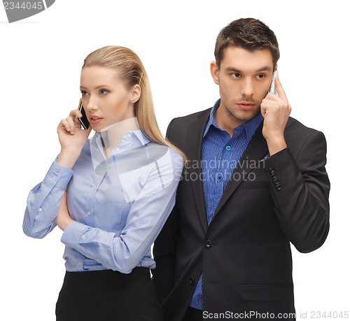 Image of man and woman with cell phones