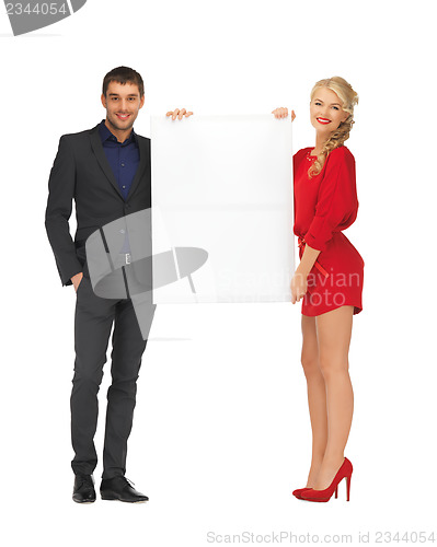 Image of couple holding big blank board