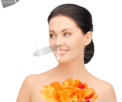 Image of woman with red flowers