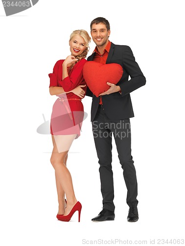 Image of beautiful couple holding big heart