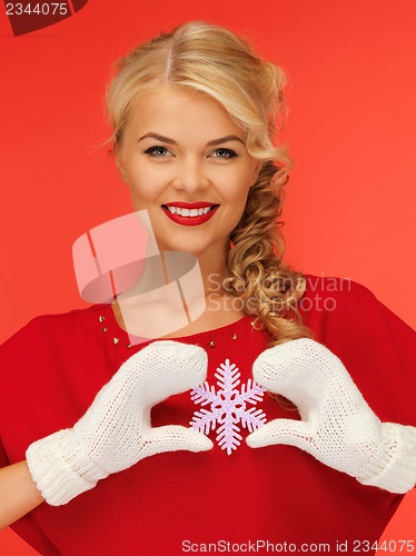 Image of woman in mittens and red dress with snowflake