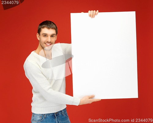 Image of handsome man with big blank board