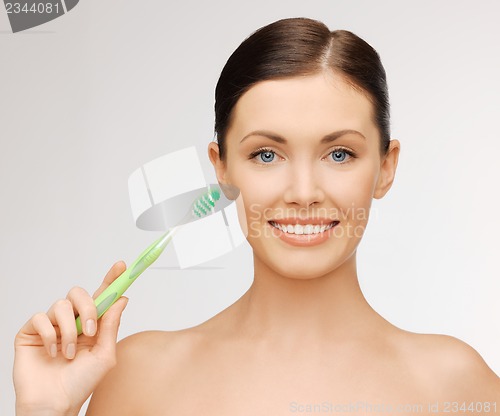 Image of woman with toothbrush