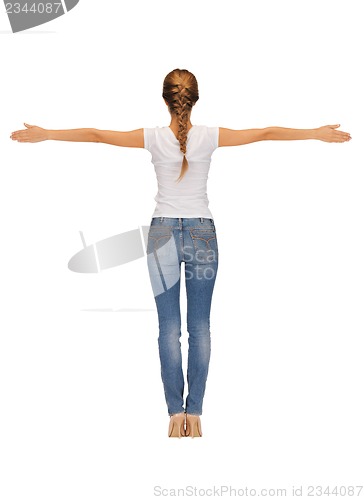 Image of rear view of woman in blank white t-shirt