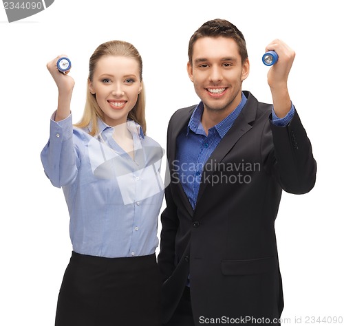 Image of man and woman with flashlights