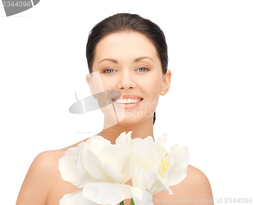 Image of lovely woman with orchid flower