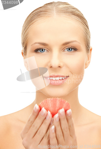 Image of beautiful woman with seashell