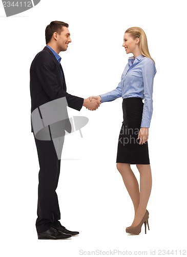 Image of man and woman shaking their hands