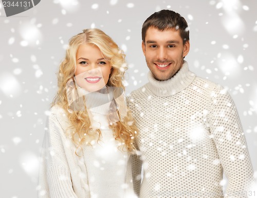 Image of family couple in a sweaters