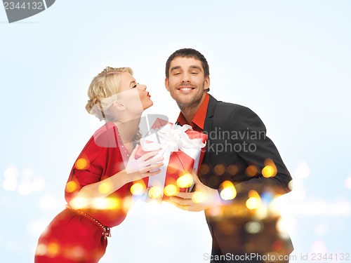 Image of man and woman with present