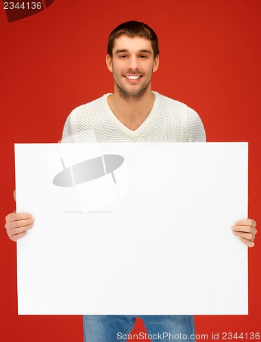 Image of handsome man with big blank board