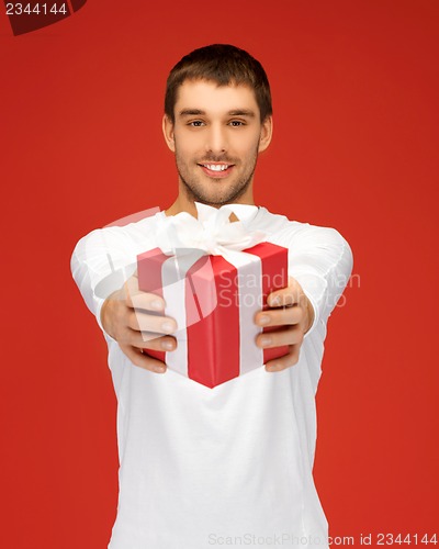 Image of handsome man with a gift