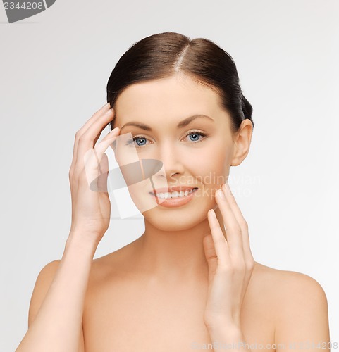Image of face and hands of beautiful woman