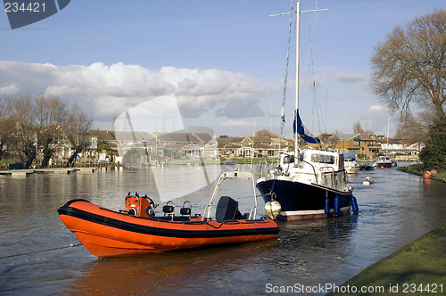 Image of Red Dinghy and Boat