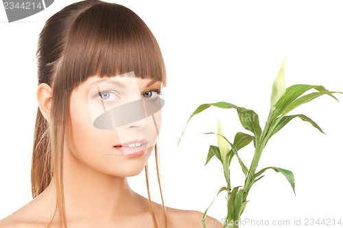 Image of woman with green sprout