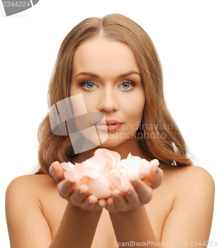 Image of beautiful woman with rose petals