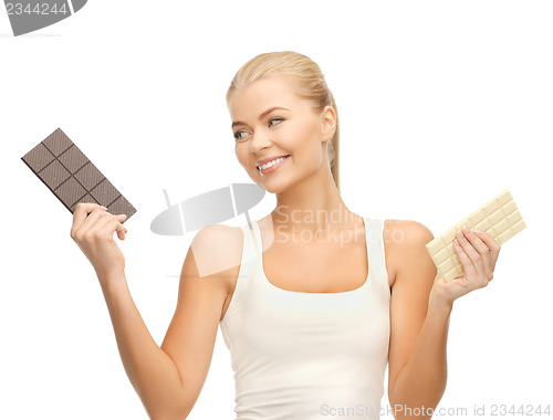 Image of smiling woman with dark and white chocolates