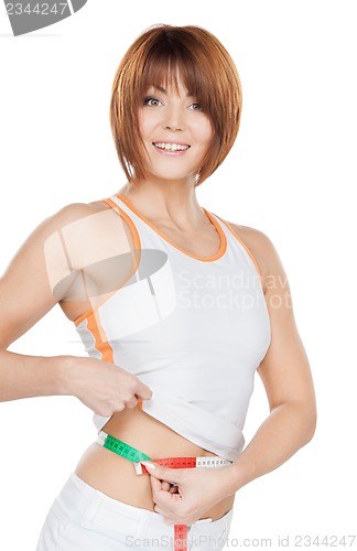 Image of woman measuring her waist