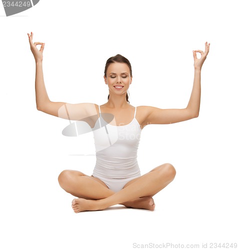 Image of young woman doing exercises, yoga, pilates