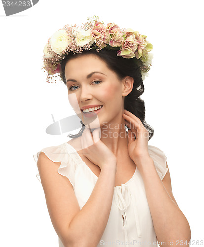 Image of woman wearing wreath of flowers