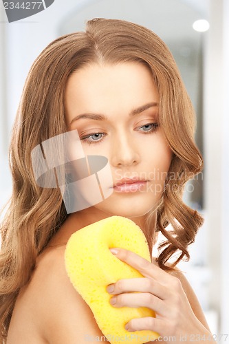 Image of beautiful woman with sponge