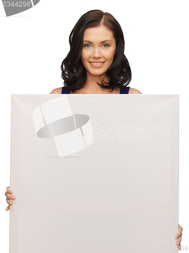 Image of lovely woman in blue dress with blank board