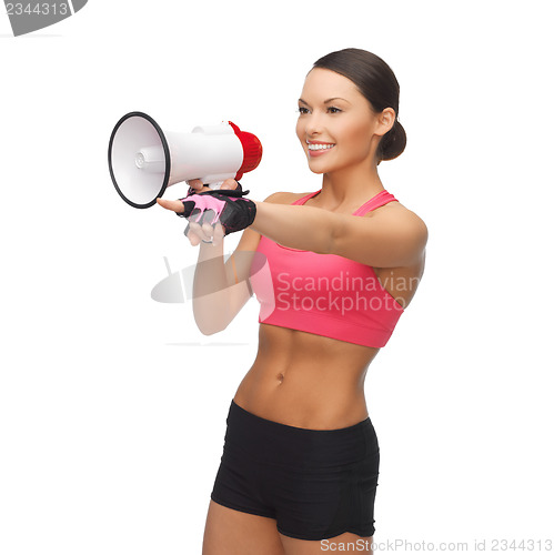 Image of woman with megaphone pointing at something