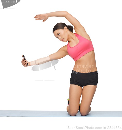 Image of beautiful sporty woman doing exercise