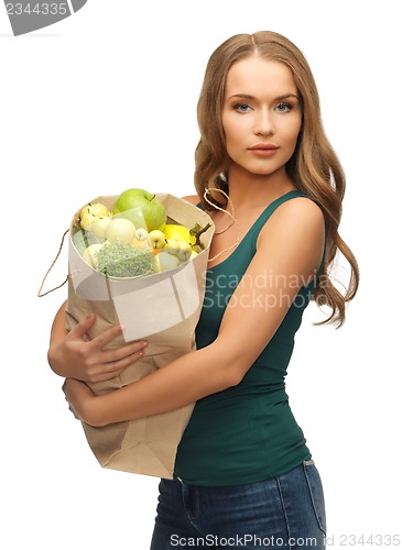 Image of woman with shopping bag full of fruits