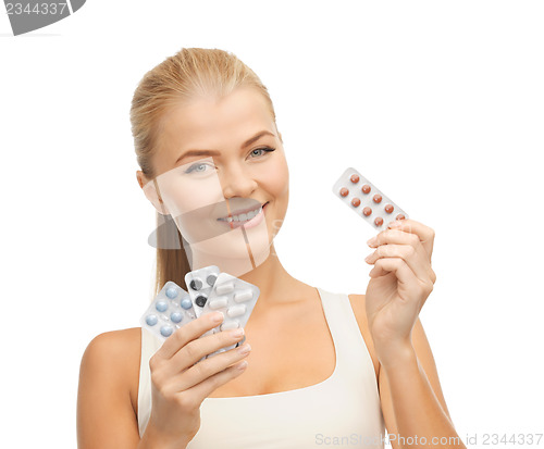 Image of young woman with pills