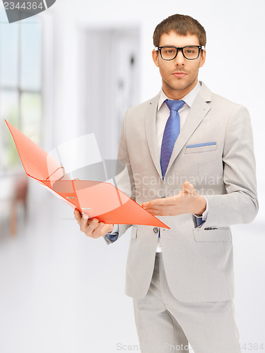 Image of man with folders
