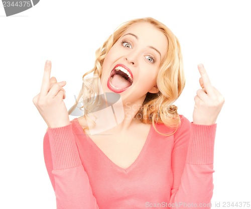 Image of excited young woman showing middle fingers