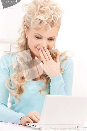 Image of happy woman with laptop computer