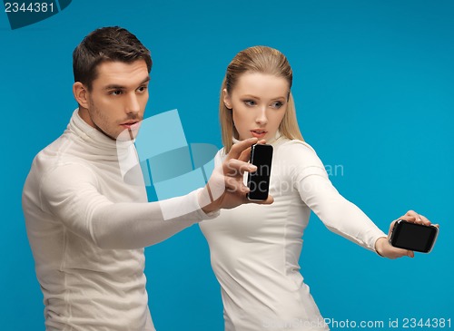 Image of man and woman with modern gadgets