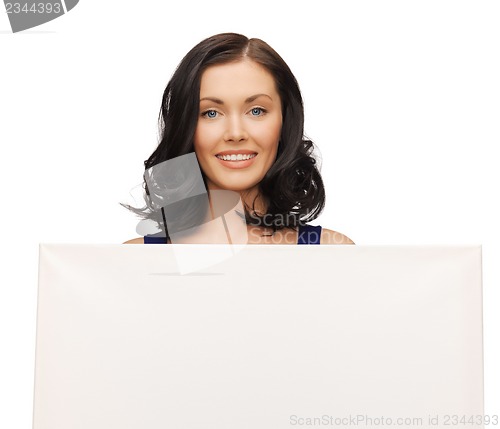 Image of lovely woman in blue dress with blank board