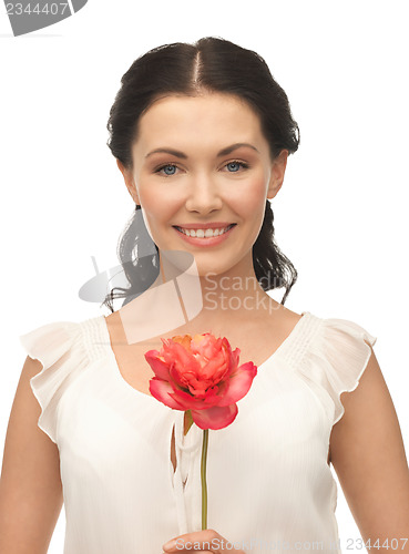 Image of young and beautiful woman with flower