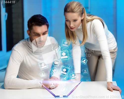 Image of man and woman working with virtual screen