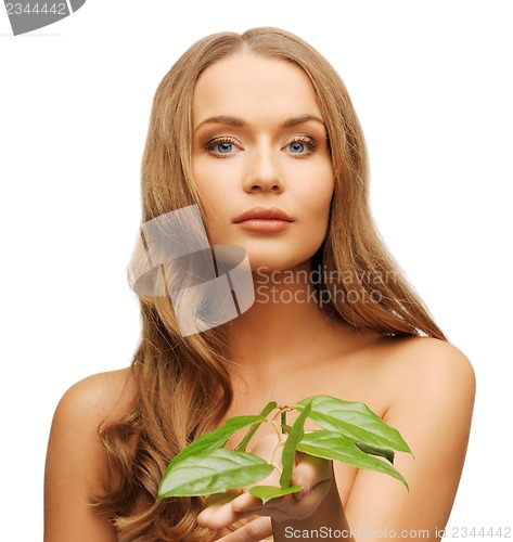 Image of woman with green leaf