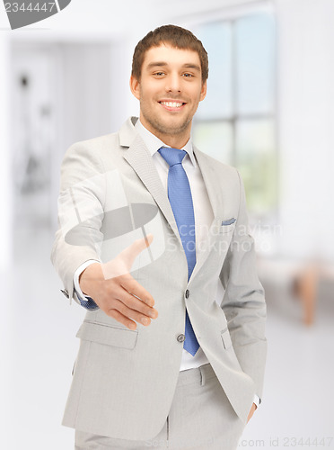 Image of man with an open hand ready for handshake