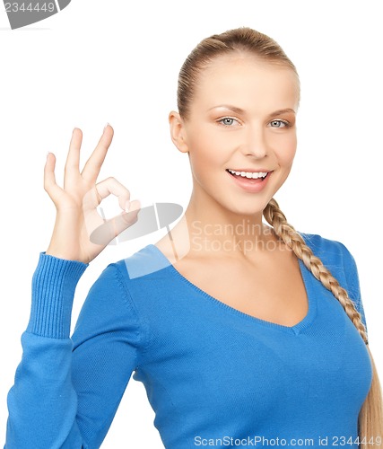 Image of young woman showing ok sign