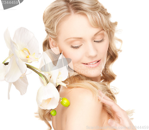 Image of lovely woman with orchid flower