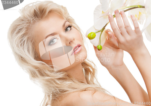 Image of lovely woman with orchid flower