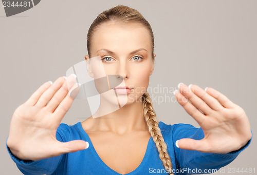 Image of woman making stop gesture