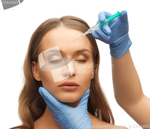 Image of woman face and beautician hands