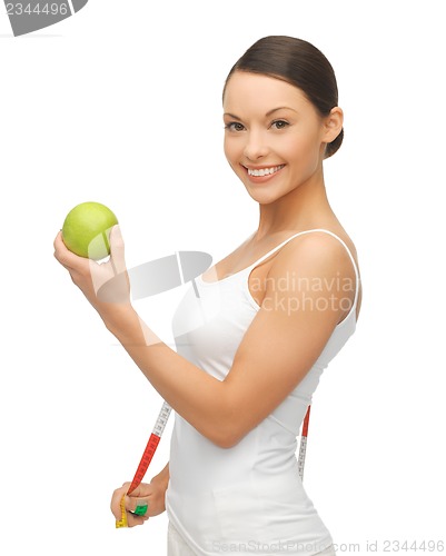 Image of woman with measuring tape and apple