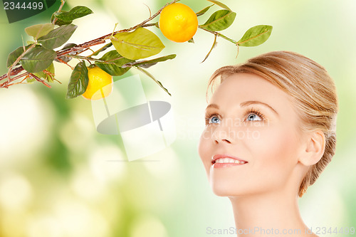 Image of woman with lemon twig