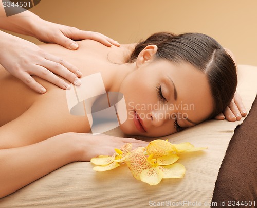 Image of beautiful woman in massage salon