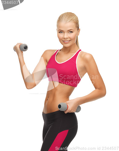 Image of young sporty woman with light dumbbells
