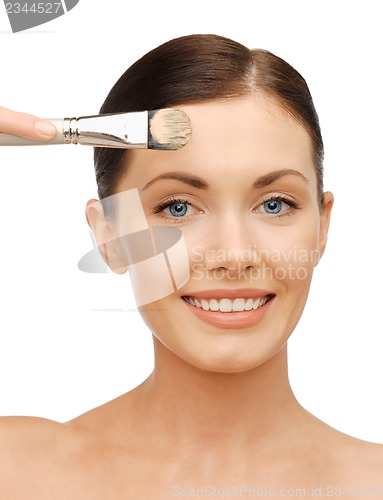 Image of beautiful woman with brush